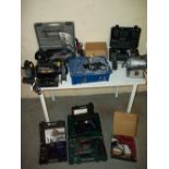 A SELECTION OF POWER TOOLS TO INCLUDE TWO BENCH GRINDERS, A TILE CUTTER AND A HAMMER DRILL.
