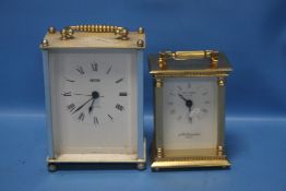 A TWO THOUSAND MILLENIUM CARRIAGE CLOCK TOGETHER WITH ANOTHER (2)