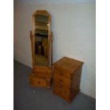 A DRESSING MIRROR AND A FOUR DRAWER NARROW CHEST IN SOLID PINE.