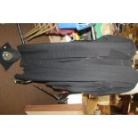 A UNIVERSITY GOWN WITH MORTAR BOARD