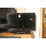 AN LG 26" TV WITH REMOTE