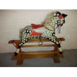 A VINTAGE ROCKING HORSE.