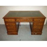 A TWIN PEDESTAL LEATHER INLAID LOCKING DESK