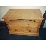 A SOLID HEAVY PINE TV MEDIA CABINET UNIT.