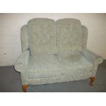 A CLEAN FABRIC MODERN TWO SEATER HIGH BACKED SOFA