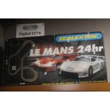 A BOXED SCALEXTRIC LE MANS 24 HOUR PORSCHE 911 SET, COMPLETE WITH ADDITIONAL COLLECTABLE CAR