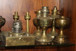 A QUANTITY OF PARAFFIN / OIL LAMPS AND SHADES