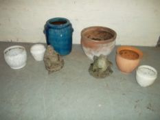 A MIXED SELECTION OF GARDEN PLANTER POTS GLAZED AND TERRACOTTA AND TWO CONCRETE STATUES.