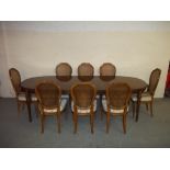 AN EXTENDING OAK DINING SET WITH EIGHT CHAIRS.