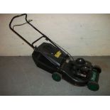 A TROJAN PETROL 18 INCH LAWNMOWER.