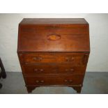 AN EDWARDIAN INLAID WRITING BUREAU.