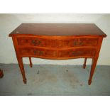 A YEW SERPENTINE FRONTED SIDE TABLE/ DESK WITH 4 LOCKING DRAWERS.