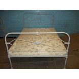 A CAST IRON DOUBLE BED FRAME