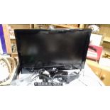 A 22" FLATSCREEN TV WITH REMOTE