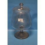 AN 18/19TH CENTURY LIDDED GLASS LEACH JAR (Ground out pontil to base) H 31 cm.