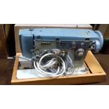 A JONES CASED SEWING MACHINE