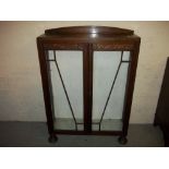 AN OAK CHINA CABINET.