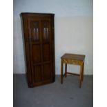 AN OAK WARDROBE AND A VINTAGE SCHOOL DESK.