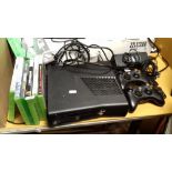 AN XBOX 360 AND ACCESSORIES TO INCLUDE TWO CONTROLLERS