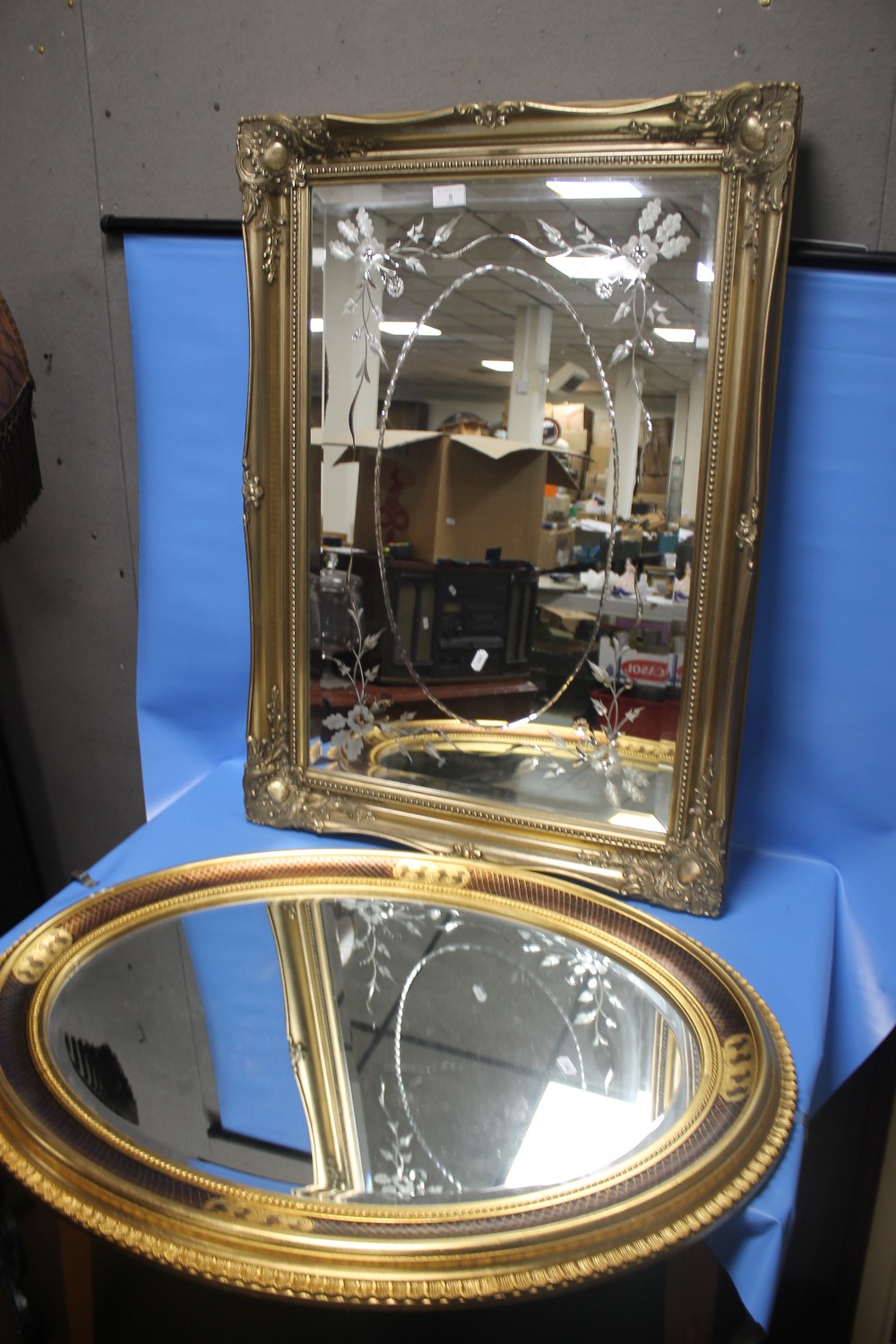 A RECTANGULAR MIRROR 90 X 64 CM TOGETHER WITH AN OVAL MIRROR APPROX. 86 X 66 CM (2)