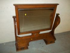 A DRESSING TABLE SWIVEL MIRROR WITH DRAWERS, IN OAK