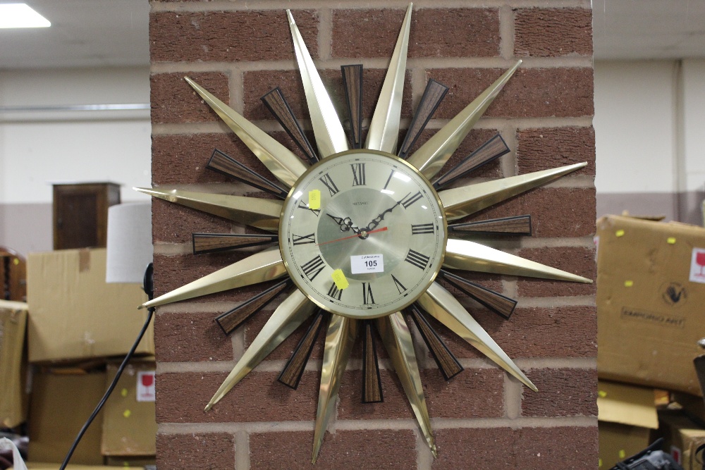 A RETRO SUNBURST METAMEC METAL SPIKED WALL CLOCK