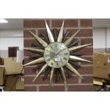 A RETRO SUNBURST METAMEC METAL SPIKED WALL CLOCK