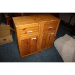 A PAIR OF MODERN PINE EFFECT BEDSIDE CABINETS