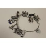 A HALLMARKED SILVER CHARM BRACELET