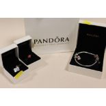 A BOXED PANDORA CHARM BRACELET WITH TWO ADDITIONAL BOXED CHARMS