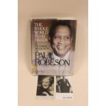 A SIGNED PHOTOGRAPH OF PAUL ROBESON, TOGETHER WITH ANOTHER AND HIS PICTORIAL BIOGRAPHY (3)