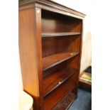 A MODERN OPEN MAHOGANY BOOKCASE