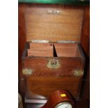 A VINTAGE OAK LIDDED BOX WITH LOWER ROTATING SECTION AND WHITE METAL MOUNTS A/F