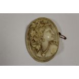 A LARGE 9CT GOLD MOUNTED CARVED CAMEO BROOCH