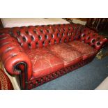 AN OXBLOOD RED LEATHER CHESTERFIELD SETTEE A/F