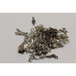 A LARGE QUANTITY OF SILVER BRACELET CHARMS