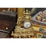 A FRENCH GILT METAL FIGURAL MANTEL CLOCK