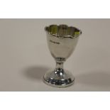 A HALLMARKED SILVER EGG CUP