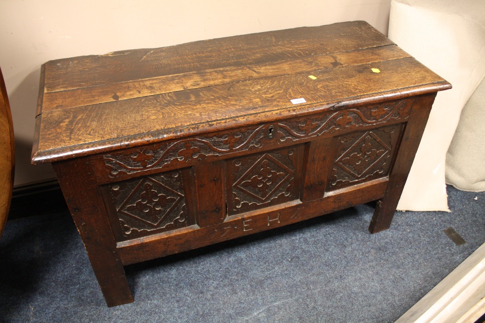 AN ANTIQUE CARVED OAK COFFER W-120 CM