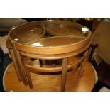 A VINTAGE TEAK NEST OF TABLES WITH GLASS TOP DIA. 81 CM H-50 CM