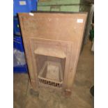 A CAST METAL ANTIQUE FIREPLACE