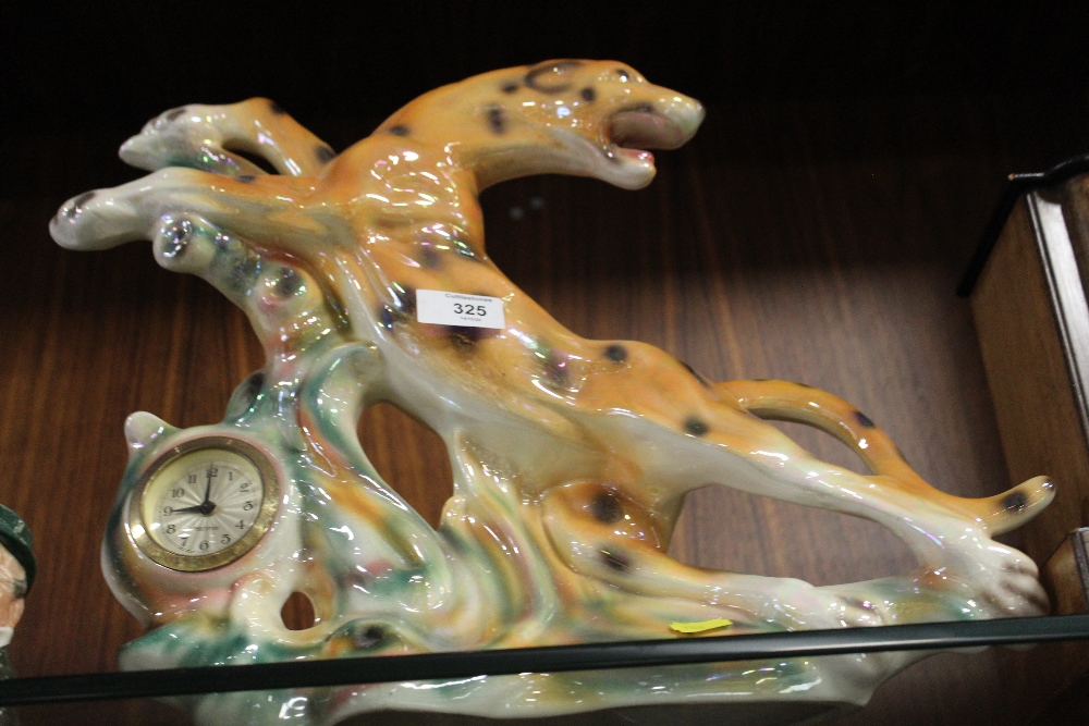 A MERCADES LUSTRE MANTEL CLOCK IN THE FORM OF A LEOPARD