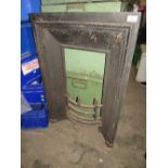 A CAST METAL ANTIQUE FIREPLACE