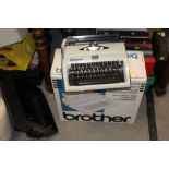 A BOXED BROTHER TYPEWRITER TOGETHER WITH A CONTESSA EXAMPLE