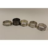 FIVE SILVER NAPKIN RINGS TO INCLUDE A CHARLES HORNER EXAMPLE