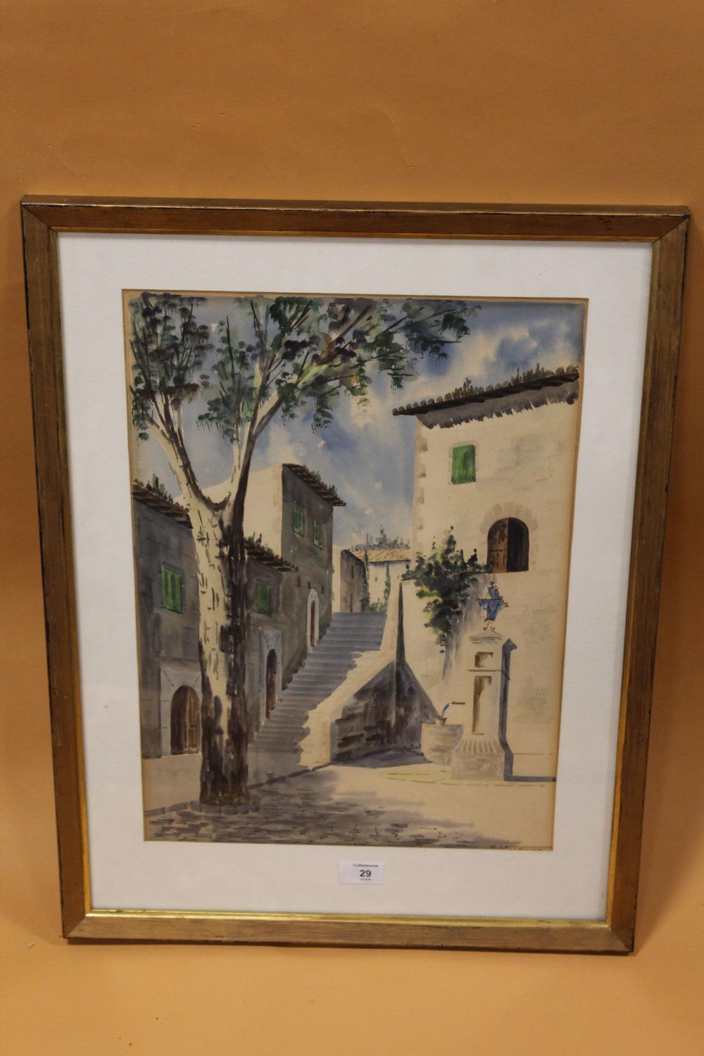 A FRAMED AND GLAZED WATERCOLOUR OF A CONTINENTAL STREET SCENE INDISTINCTLY SIGNED LOWER RIGHT