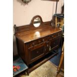 AN OAK BARLEYTWIST MIRROR BACKED SIDEBOARD