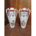 A PAIR OF TWIN HANDLED HAND PAINTED DRESDEN VASES