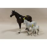 A LARGE BESWICK RACEHORSE FIGURE A/F, TOGETHER WITH A BESWICK DAPPLE GREY HORSE AND FOAL (3)