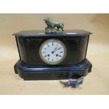 A VINTAGE SLATE MANTEL CLOCK WITH BRASS LION FINIAL